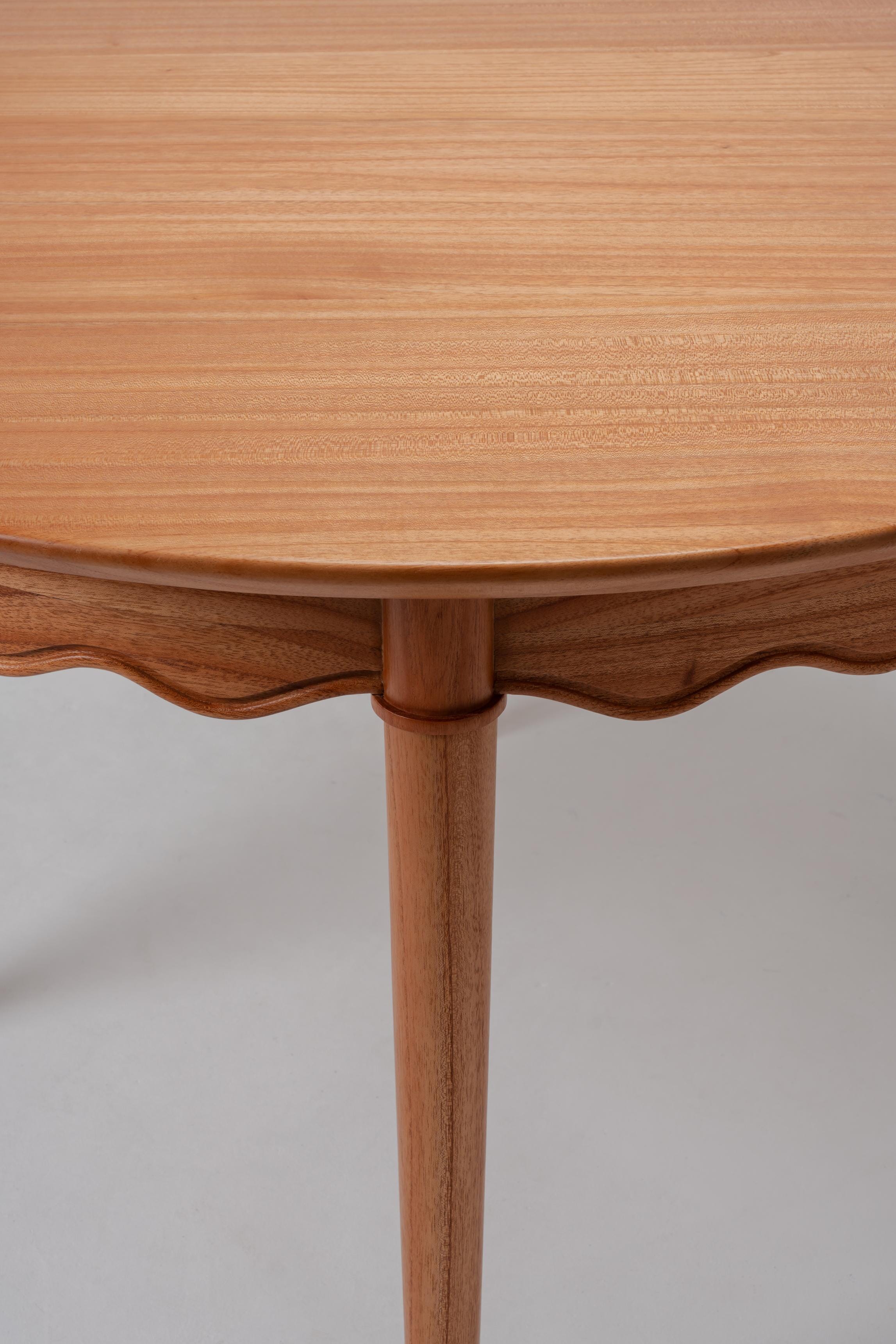 light solid wood dining table, circle top