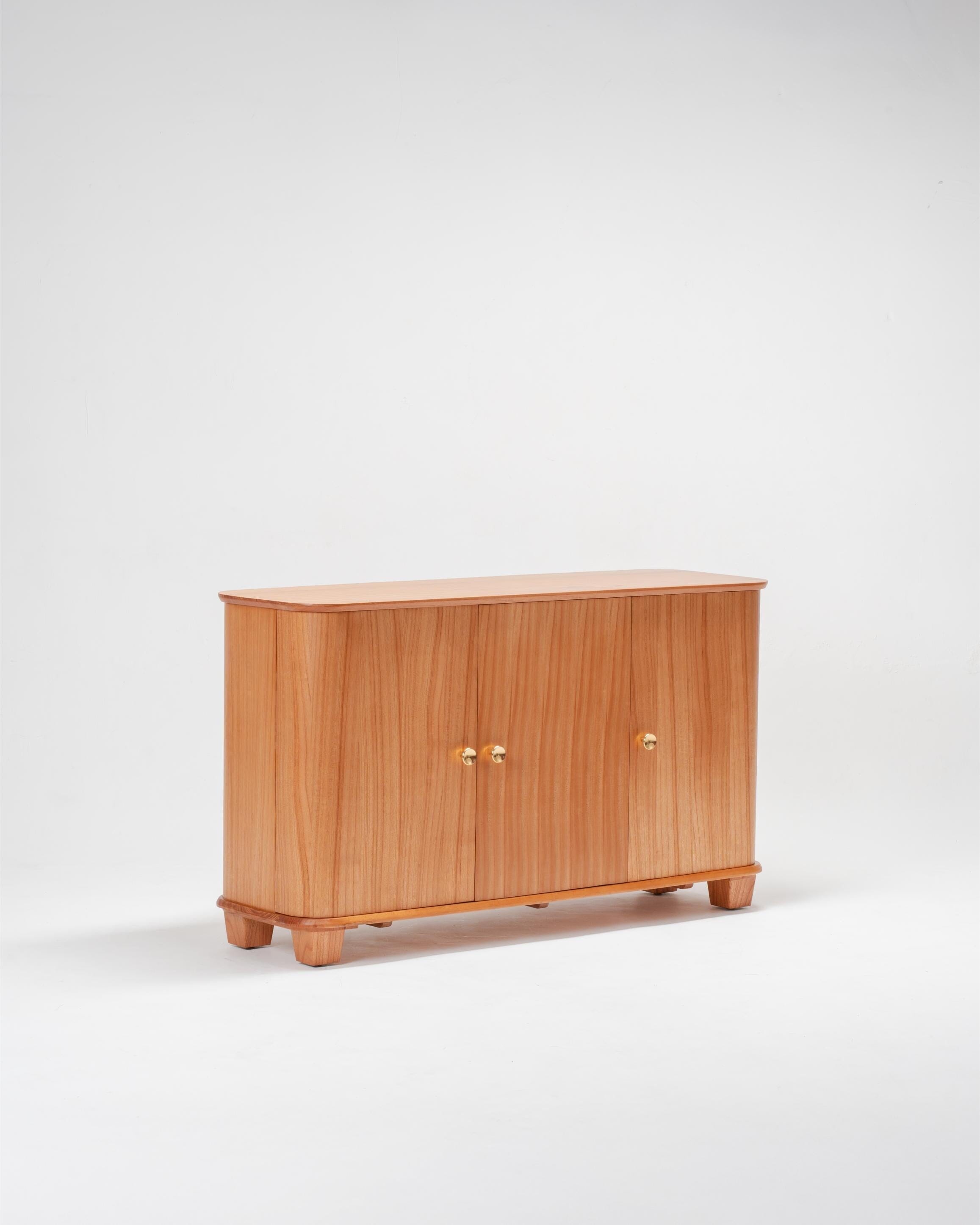 Wooden scandinavian sideboard with three doors on a white background