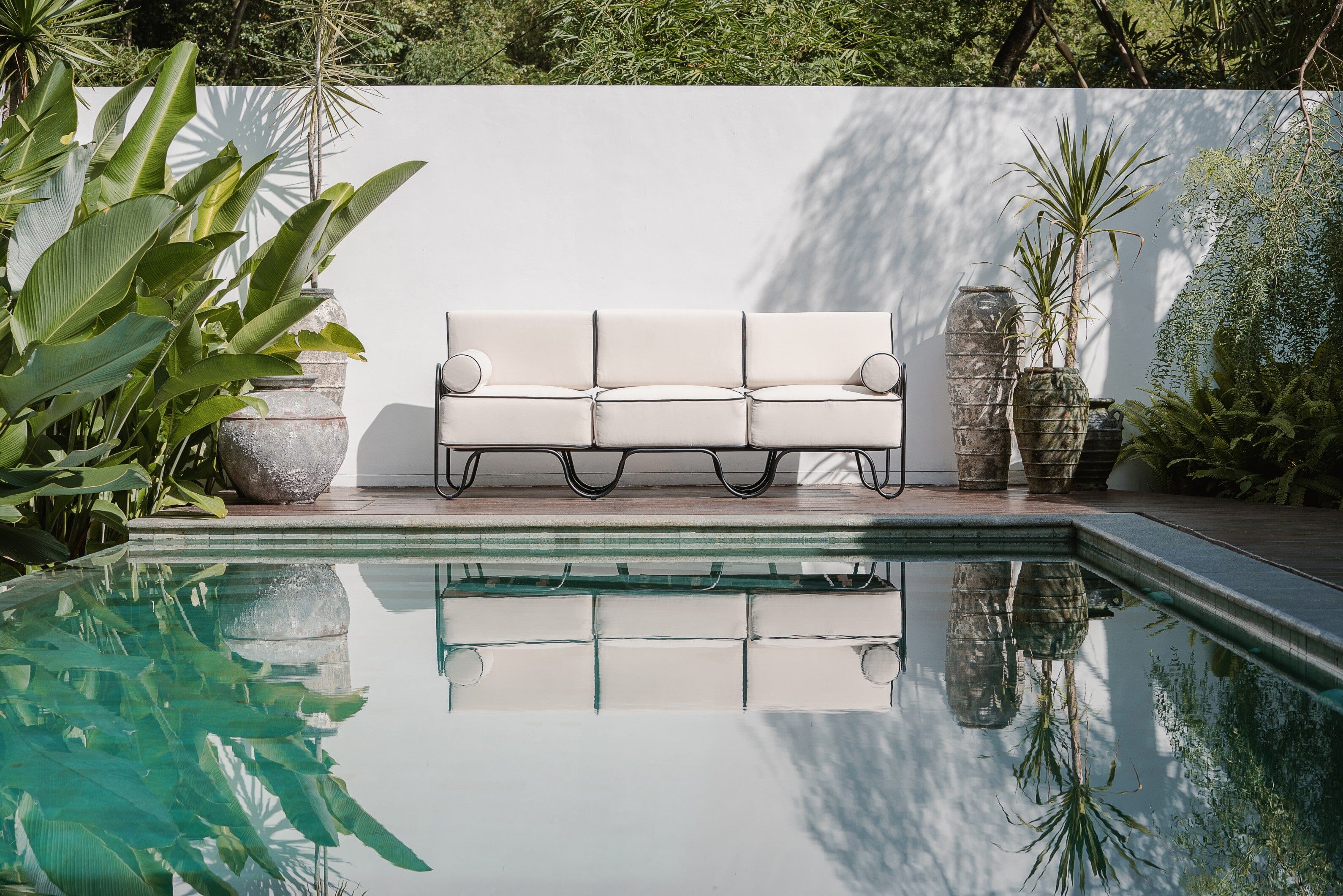 white and black outdoor sofa, pool side