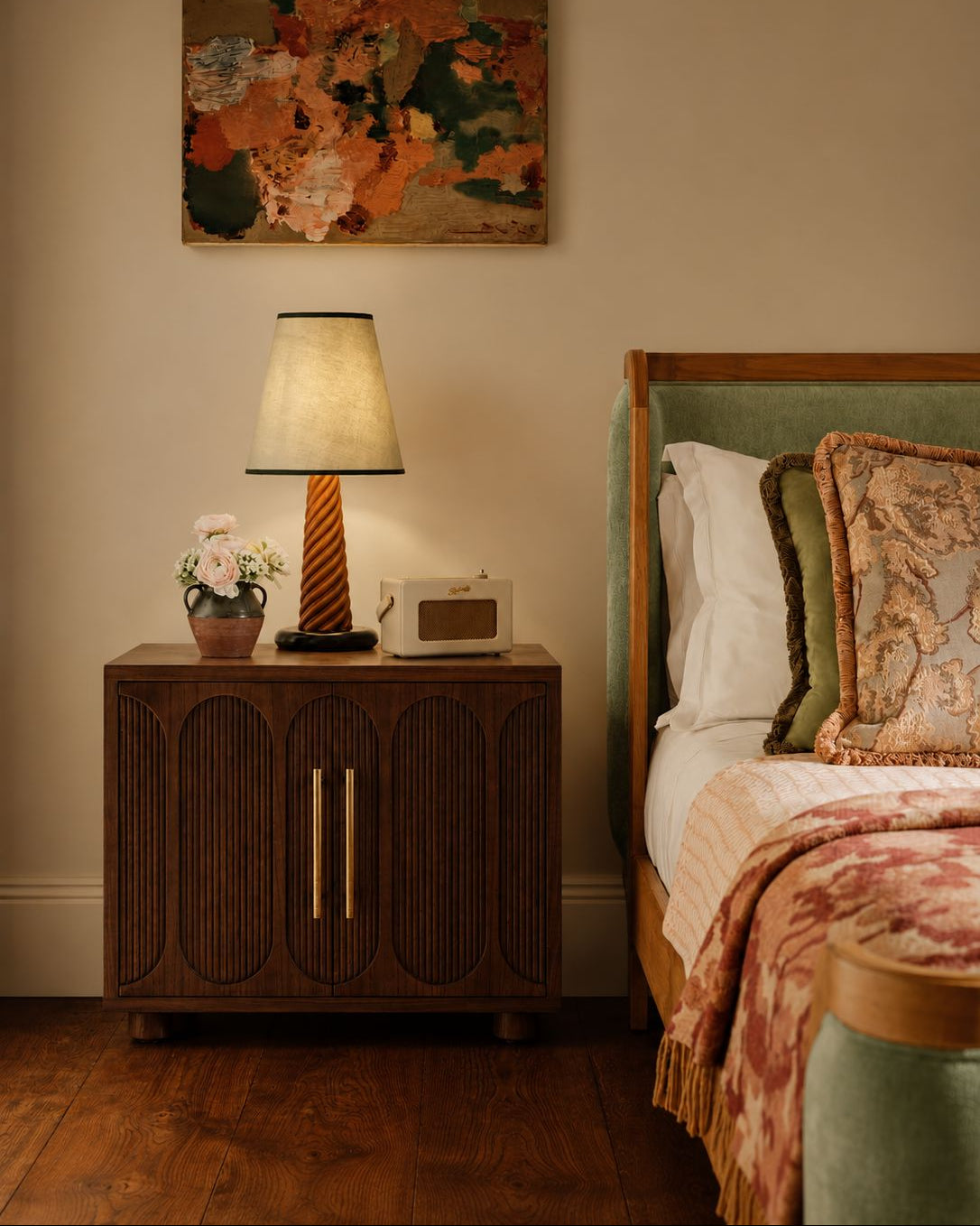 Large dark wood bedside table in a bedroom setting