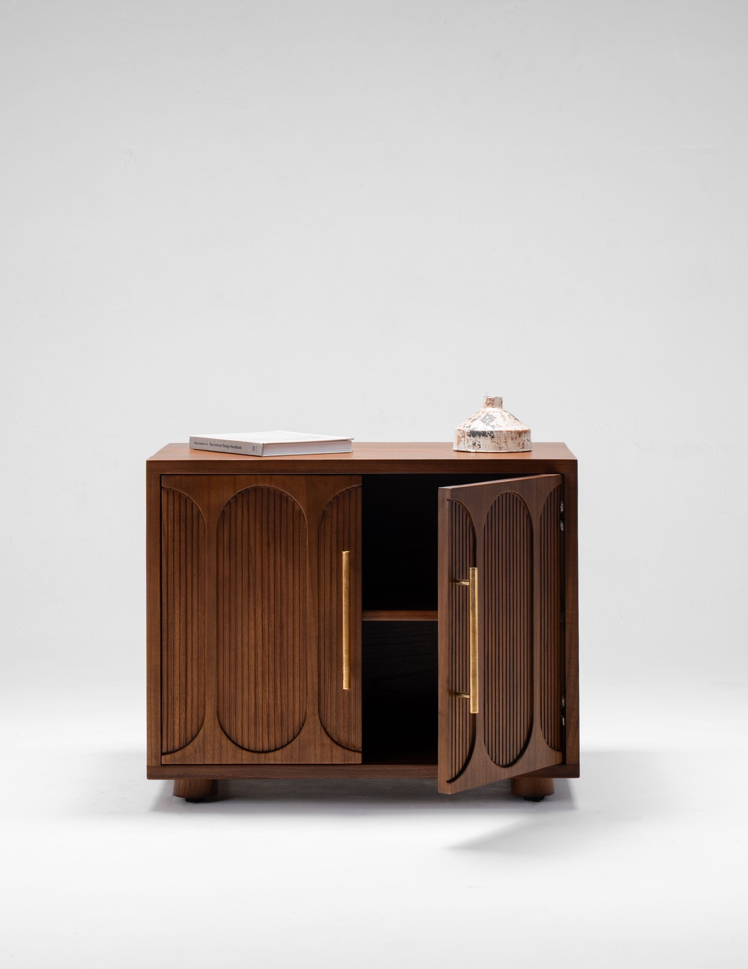 large wood nightstand with doors and brass handles