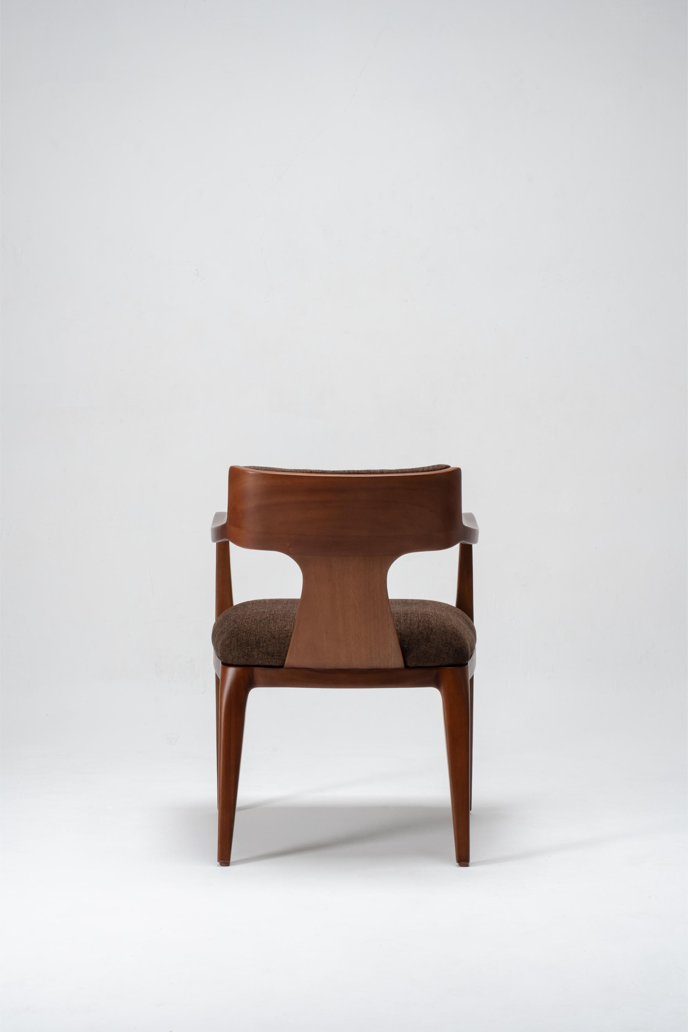 Brown chair dining with wooden frame and cushioned seat