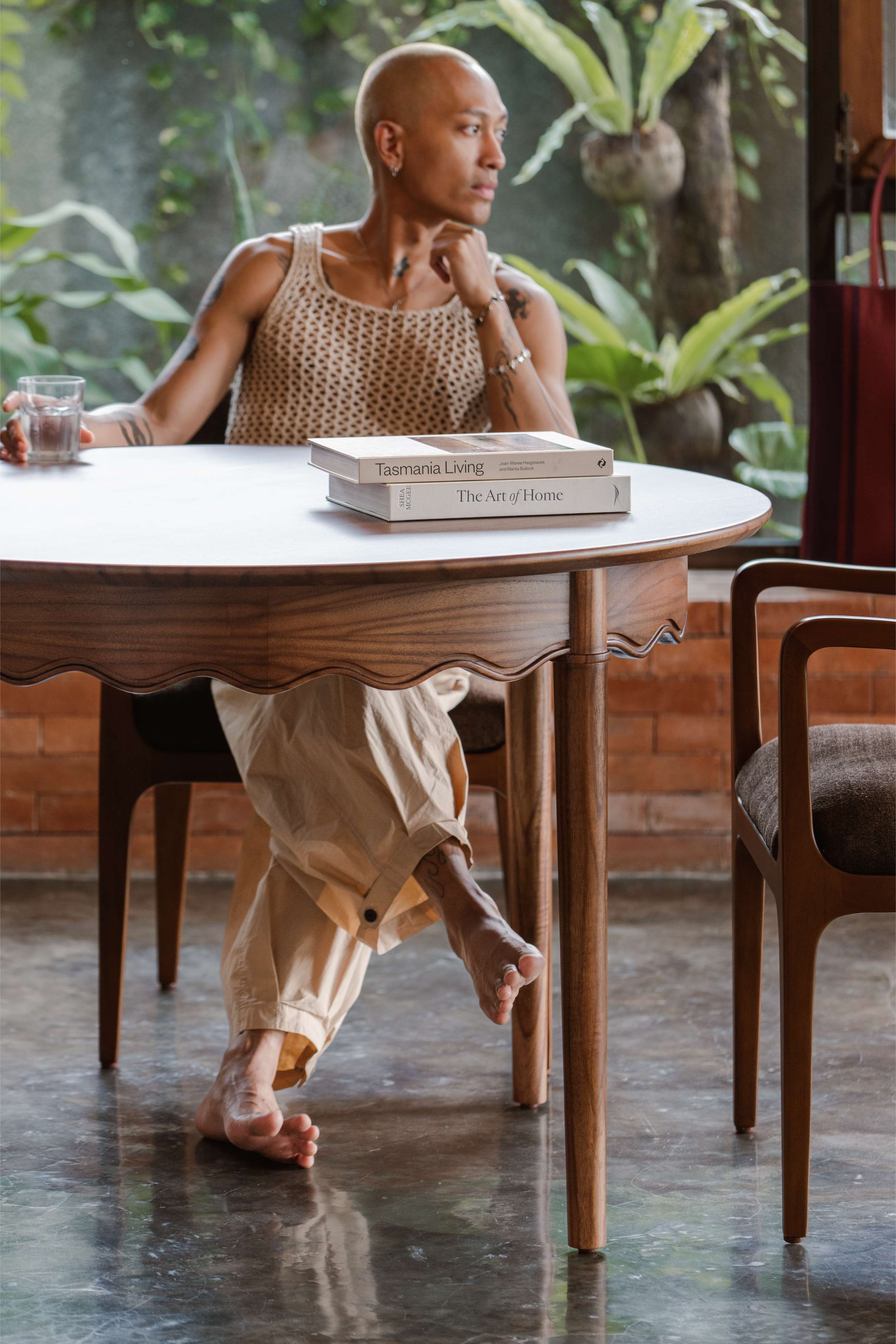 person sitting on wood dining chair