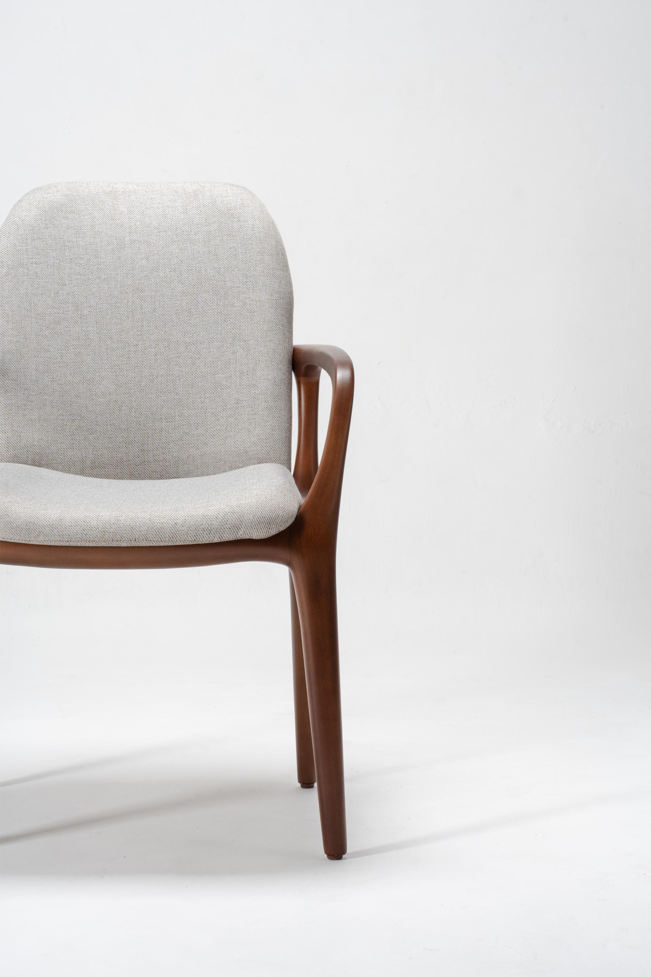 Chair with grey cushion and wooden frame