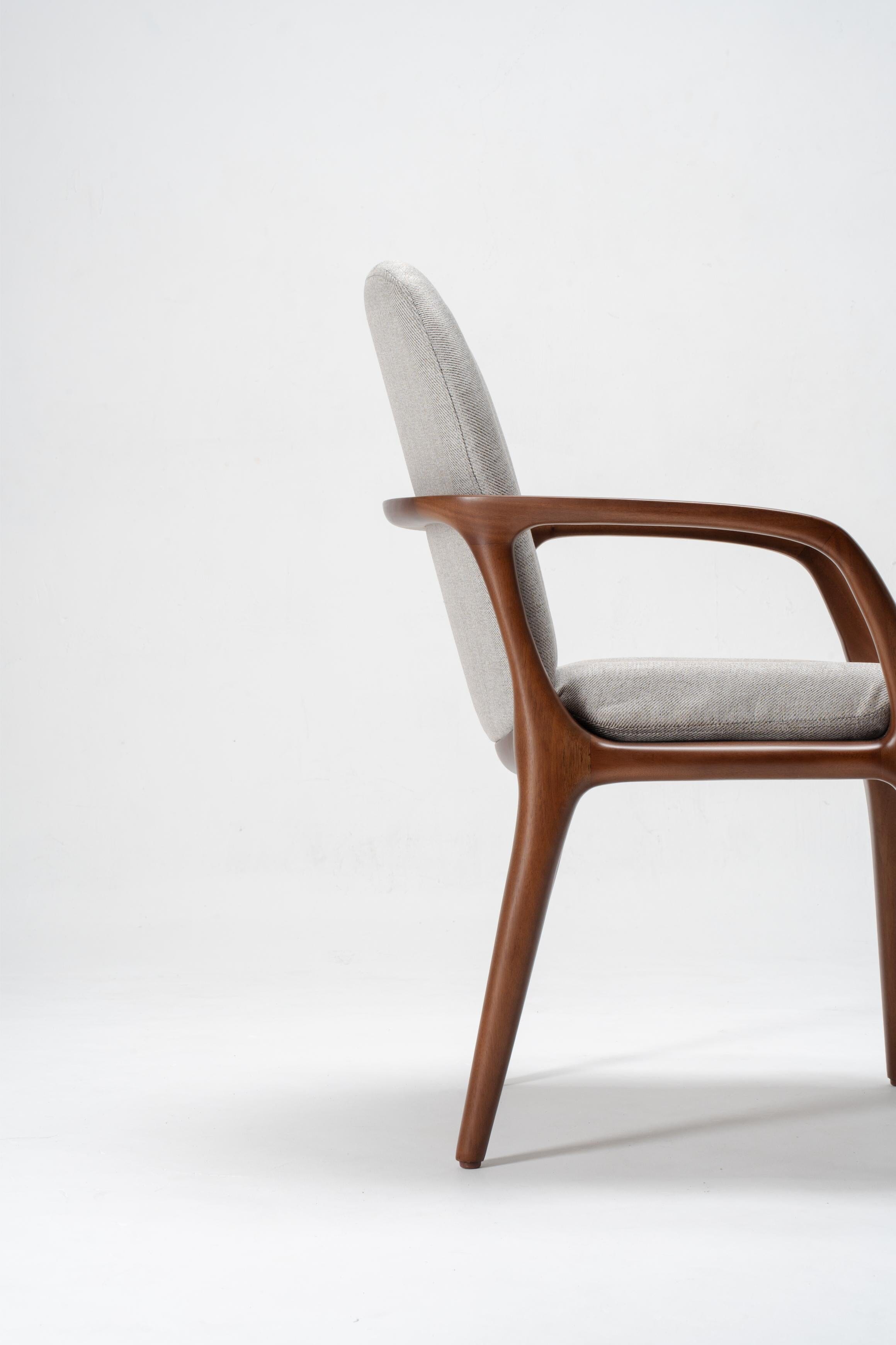 wooden dining chairs, upholstered in grey fabric