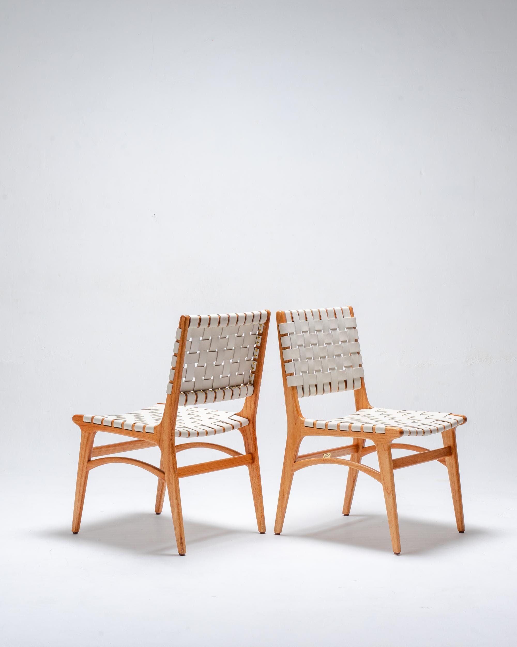 two white leather chairs by Larkwood Furniture