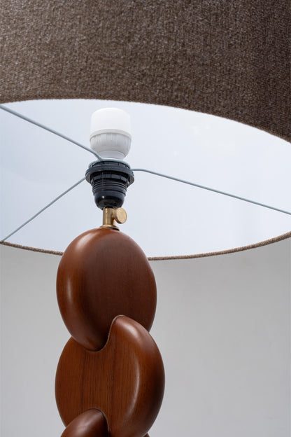 close up of brown floor lamp shade and wood stand