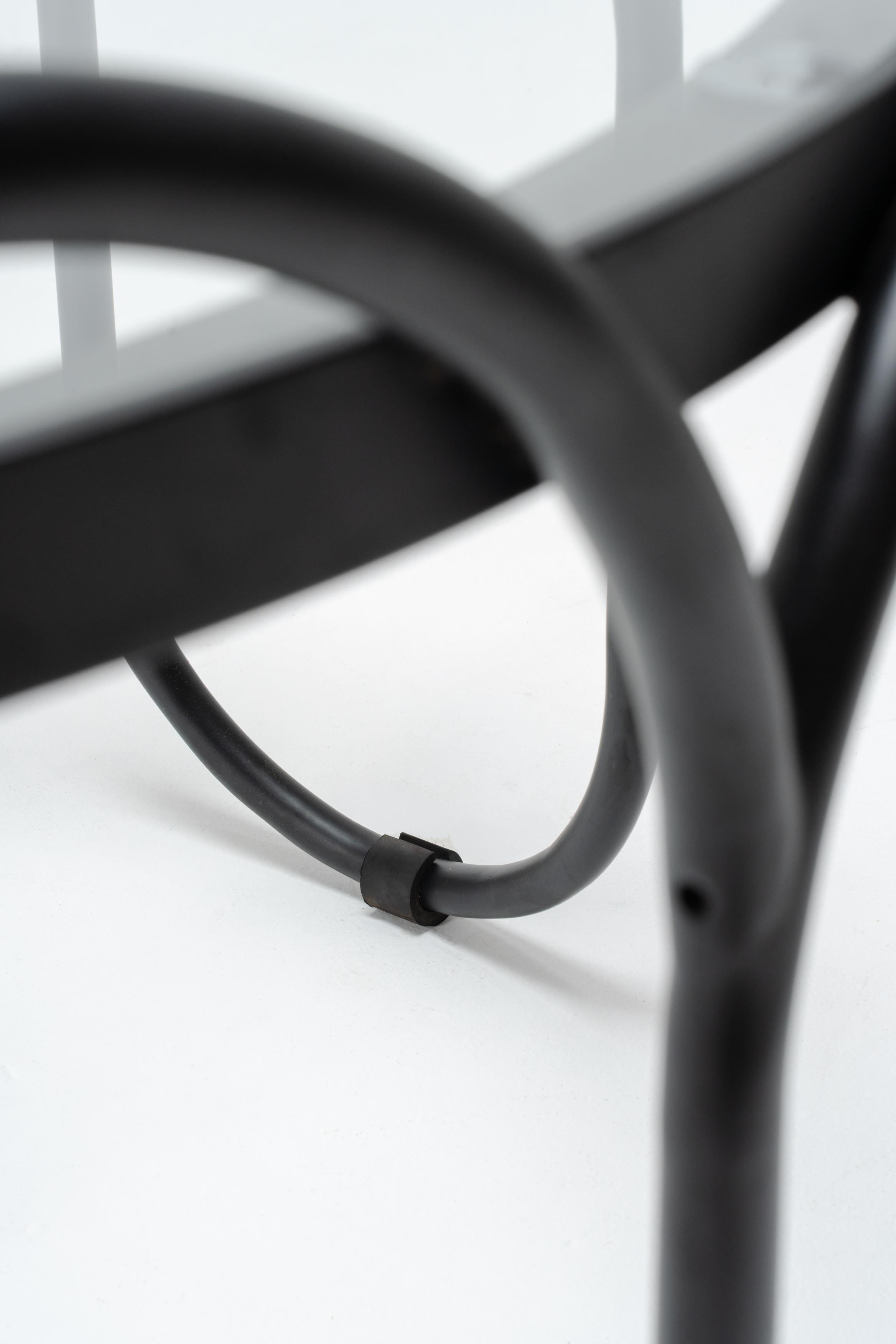 close up black powder coated metal outdoor coffee table