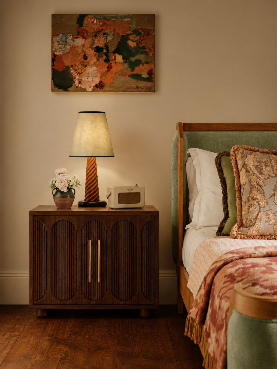 Large dark wood bedside table in a bedroom setting