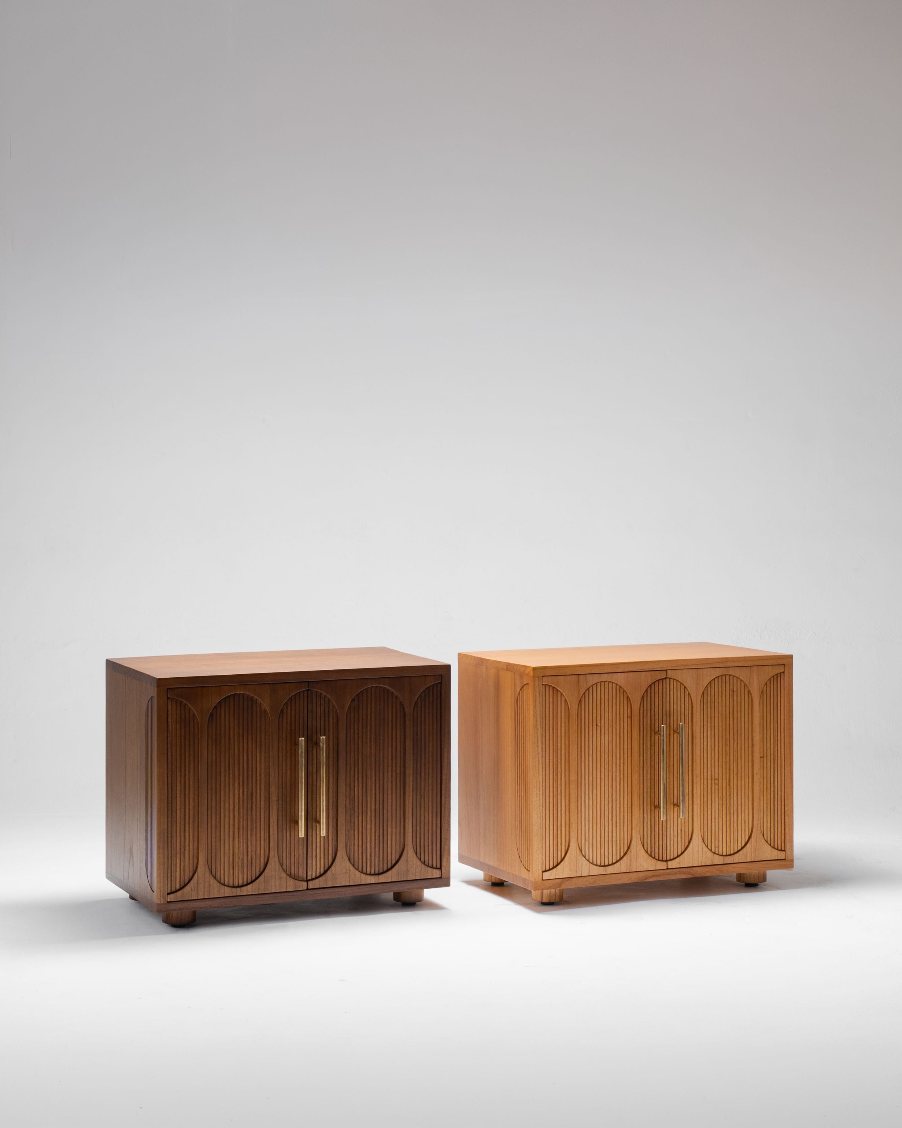 Two wooden nightstands with arched design on a light gray background