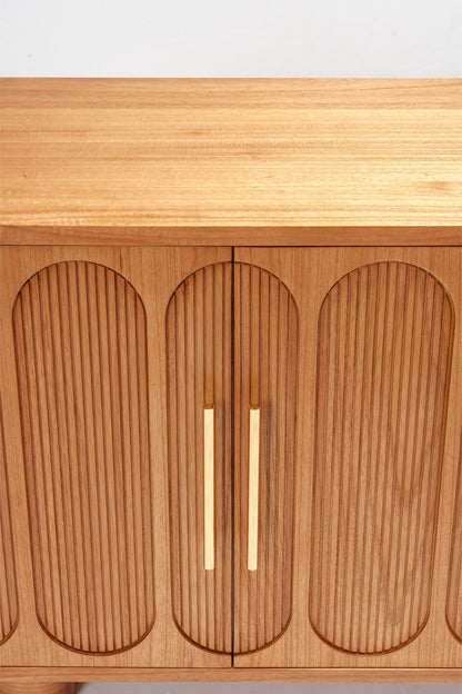 light wood detail on a large buffet storage console