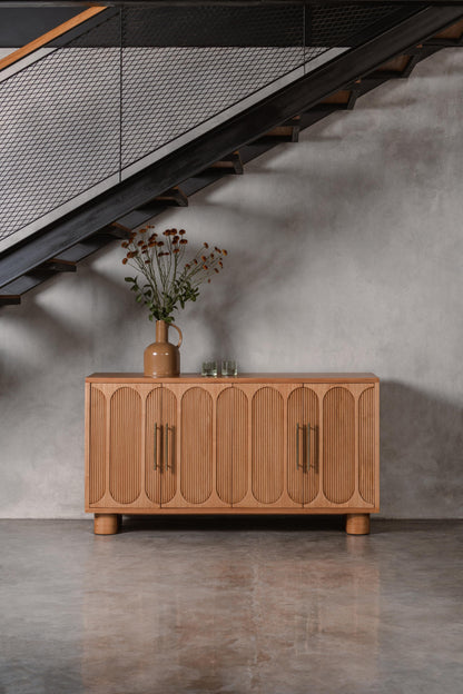 light wooden sideboard with decorative doors and brass handles