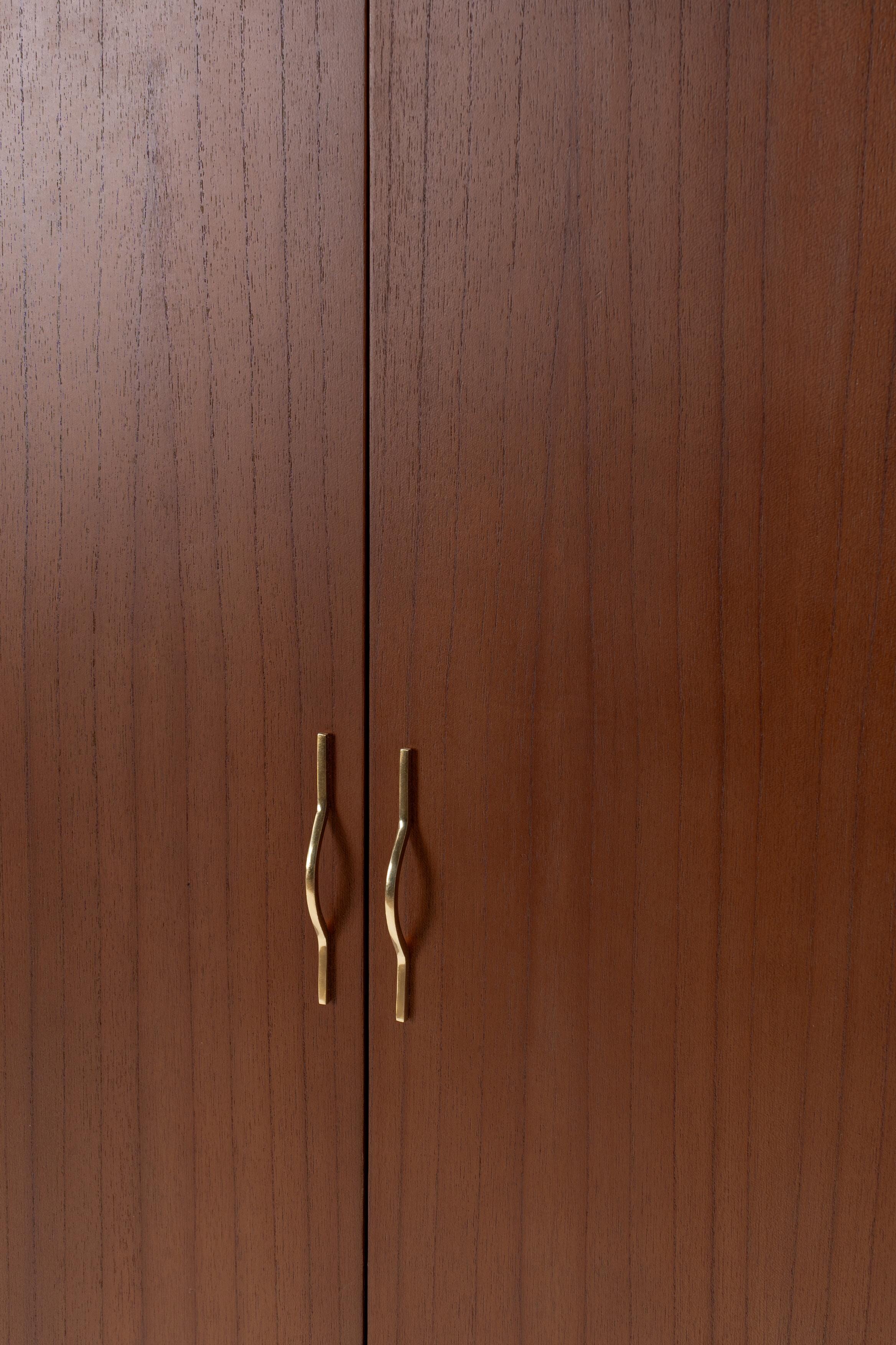 Wooden cabinet with brass handles