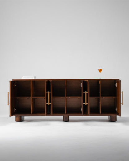 A mid-century modern wooden sideboard cabinet with open doors, featuring brass handles