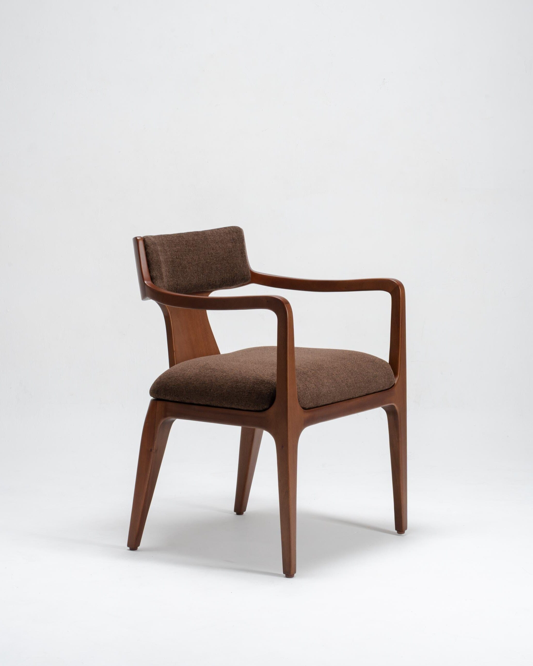 Brown dining chair with arms on a white background