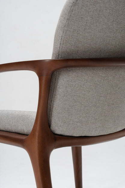 grey upholstered dining chair, detailed woodworking on solid mahogany wood