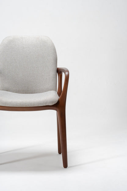 Chair with grey cushion and wooden frame